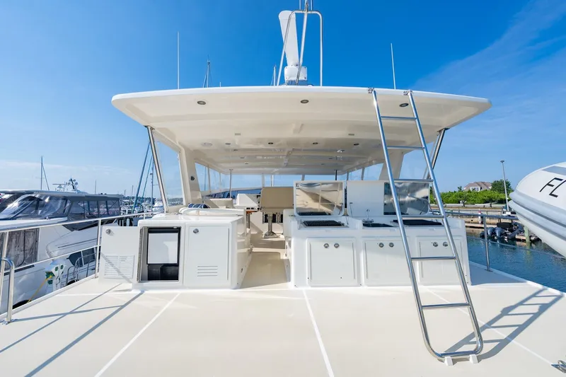 Dash Yacht Photos Pics 2016 Grand Banks 72 Aleutian RP yacht deck with outdoor kitchen and ladder.