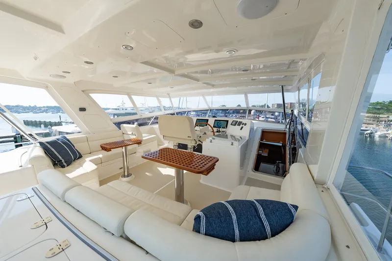 Dash Yacht Photos Pics Luxurious interior of 2016 Grand Banks 72 Aleutian RP yacht with plush seating and helm.