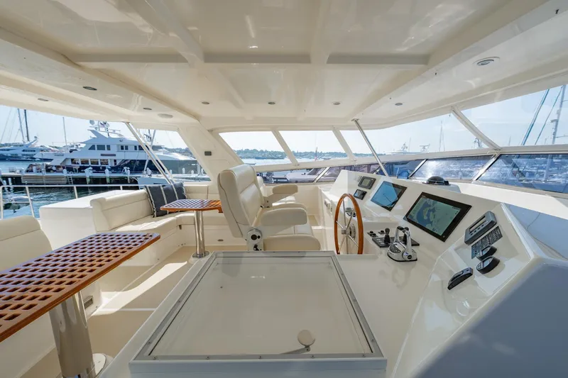 Dash Yacht Photos Pics Luxurious 2016 Grand Banks 72 Aleutian RP yacht interior with modern navigation equipment and plush seating.