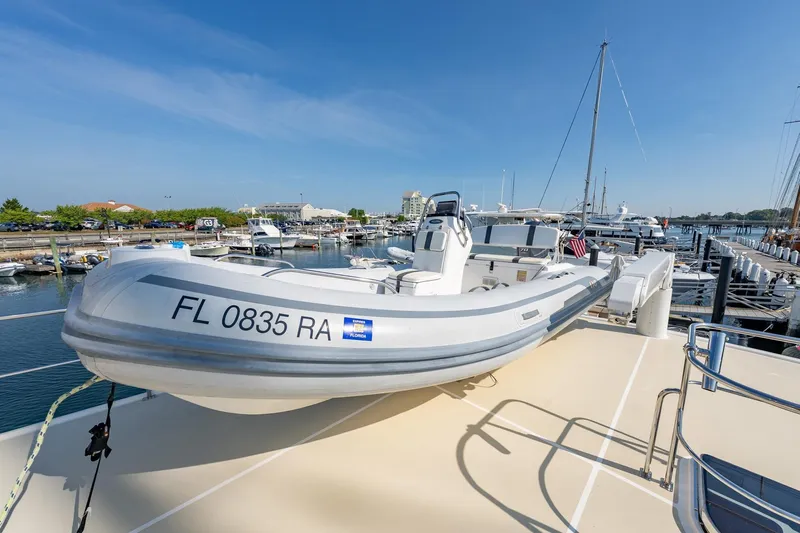 Dash Yacht Photos Pics 2016 Grand Banks 72 Aleutian RP yacht with tender docked at marina.