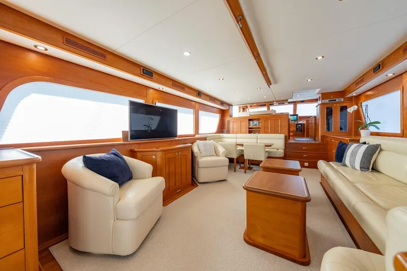 Dash Yacht Photos Pics Luxurious interior of 2016 Grand Banks 72 Aleutian RP yacht with elegant wood and leather furnishings.