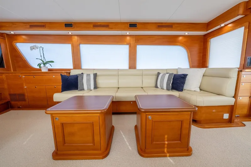 Dash Yacht Photos Pics Luxurious interior of 2016 Grand Banks 72 Aleutian RP yacht with elegant seating and wooden accents.