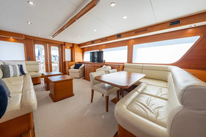 Dash Yacht Photos Pics Luxurious interior of 2016 Grand Banks 72 Aleutian RP yacht with elegant seating and wood finishes.