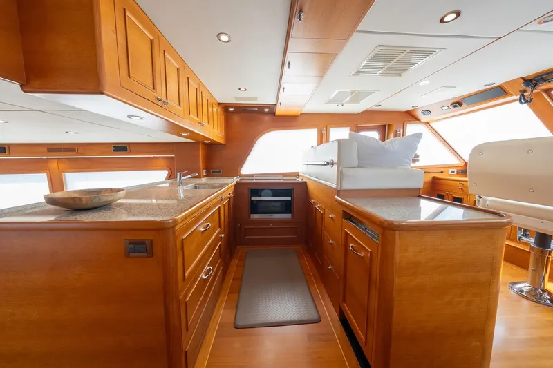 Dash Yacht Photos Pics Luxurious 2016 Grand Banks 72 Aleutian RP yacht interior with elegant wood cabinetry and modern amenities.