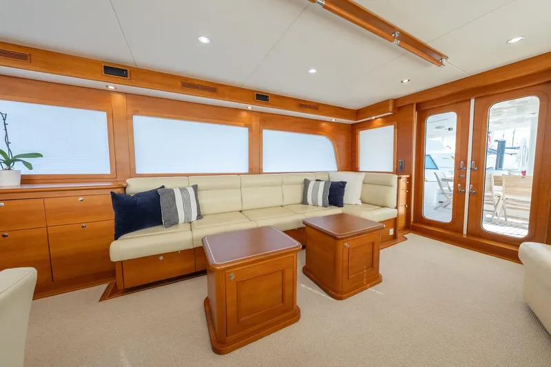 Dash Yacht Photos Pics Luxurious interior of 2016 Grand Banks 72 Aleutian RP yacht with elegant seating and wooden accents.