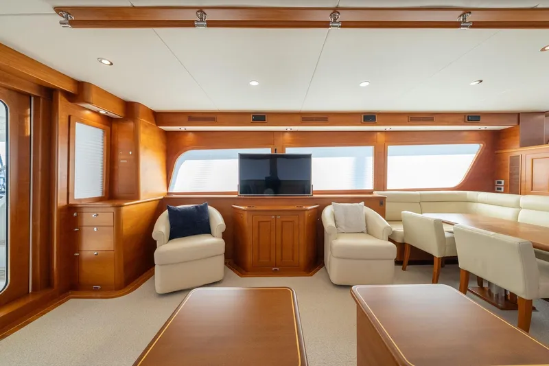 Dash Yacht Photos Pics Luxurious interior of 2016 Grand Banks 72 Aleutian RP yacht with elegant seating and wood finishes.