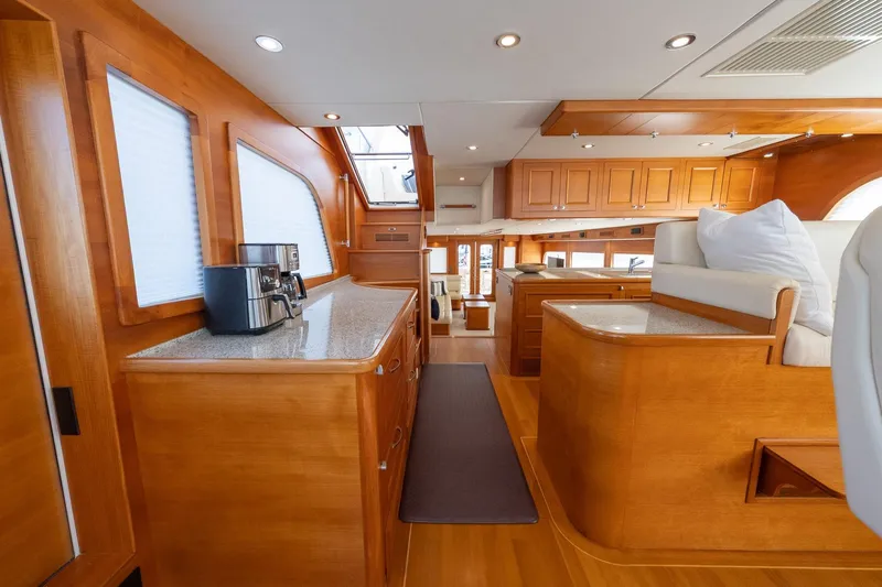 Dash Yacht Photos Pics Luxurious interior of 2016 Grand Banks 72 Aleutian RP yacht with elegant wood finishes.