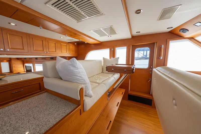 Dash Yacht Photos Pics Luxurious interior of 2016 Grand Banks 72 Aleutian RP yacht with elegant wood finishes.
