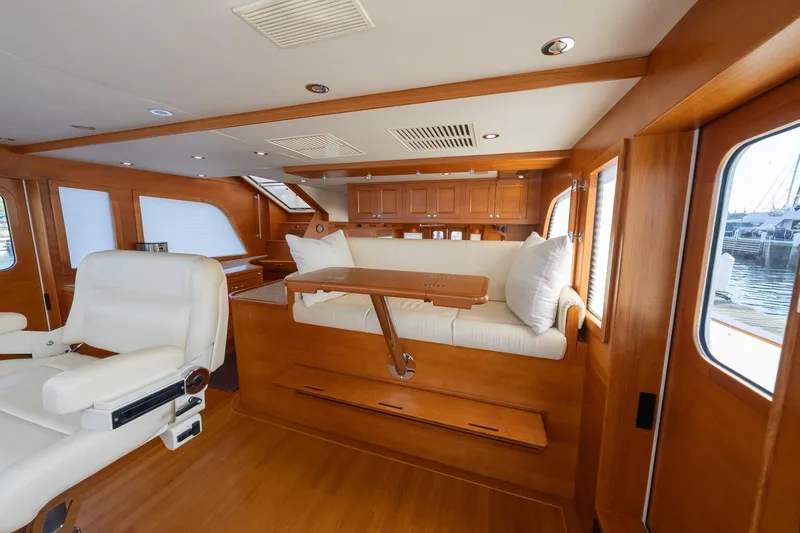 Dash Yacht Photos Pics Luxurious interior of 2016 Grand Banks 72 Aleutian RP yacht with elegant wood finish.