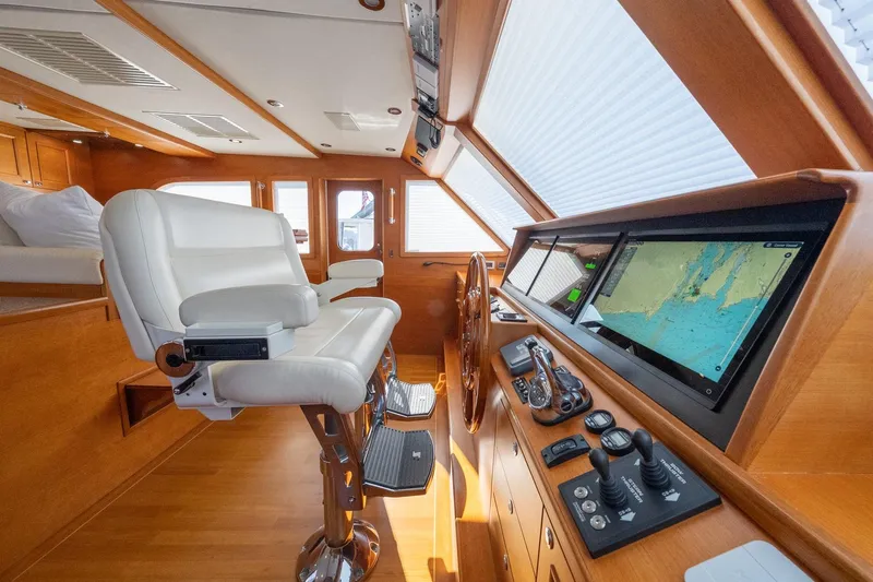 Dash Yacht Photos Pics Luxurious helm of 2016 Grand Banks 72 Aleutian RP with navigation screens and controls.