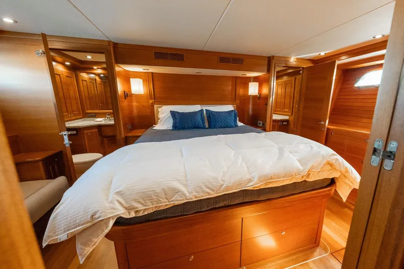 Dash Yacht Photos Pics Luxurious cabin interior of 2016 Grand Banks 72 Aleutian RP yacht with wooden finishes.