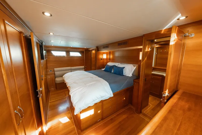 Dash Yacht Photos Pics Luxurious 2016 Grand Banks 72 Aleutian RP yacht bedroom with elegant wood finish.