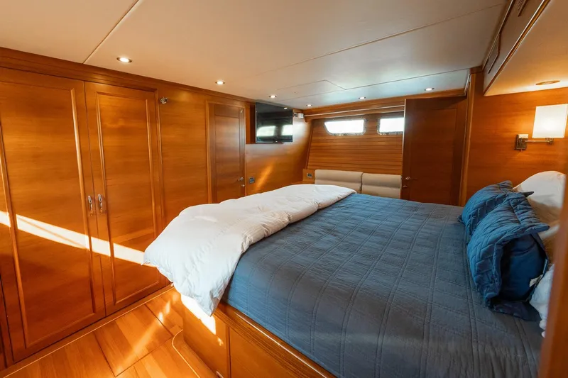 Dash Yacht Photos Pics Luxurious cabin interior of 2016 Grand Banks 72 Aleutian RP yacht with wood paneling.