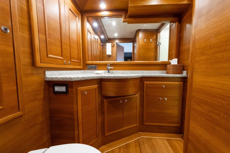 Dash Yacht Photos Pics Luxurious wooden bathroom interior on 2016 Grand Banks 72 Aleutian RP yacht.