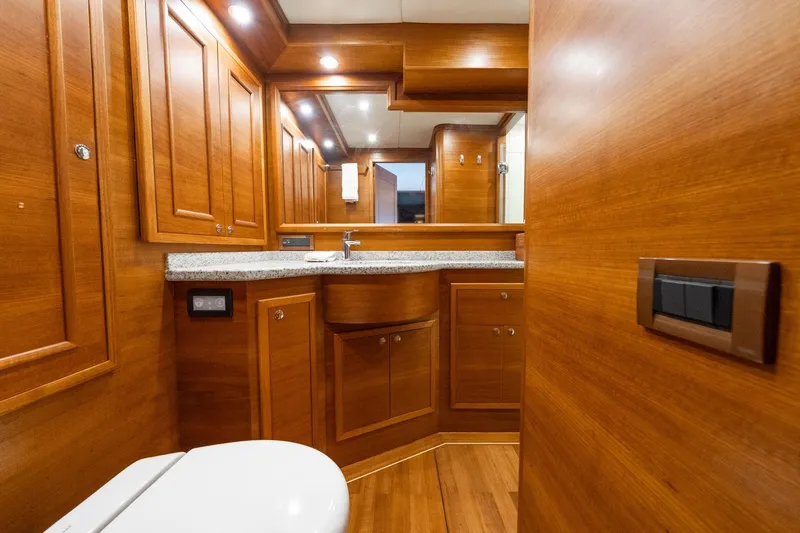 Dash Yacht Photos Pics Luxurious wooden bathroom interior of 2016 Grand Banks 72 Aleutian RP yacht.