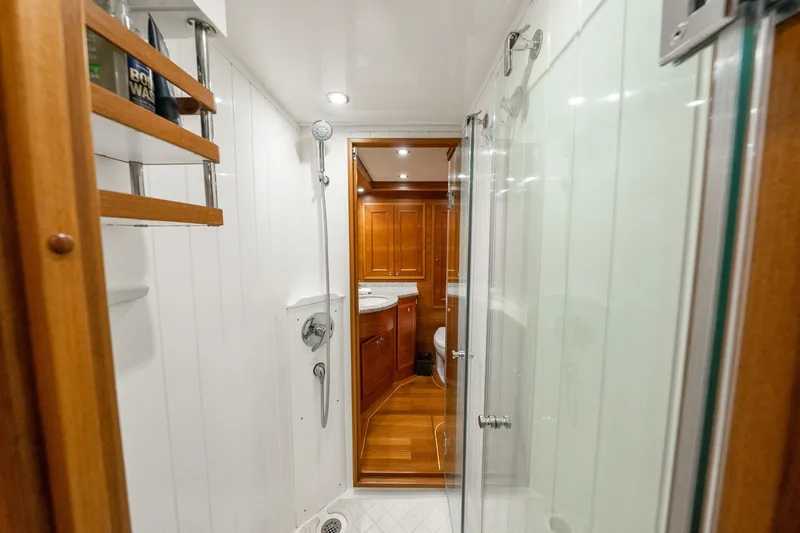 Dash Yacht Photos Pics Luxurious bathroom interior of 2016 Grand Banks 72 Aleutian RP yacht with wooden accents.