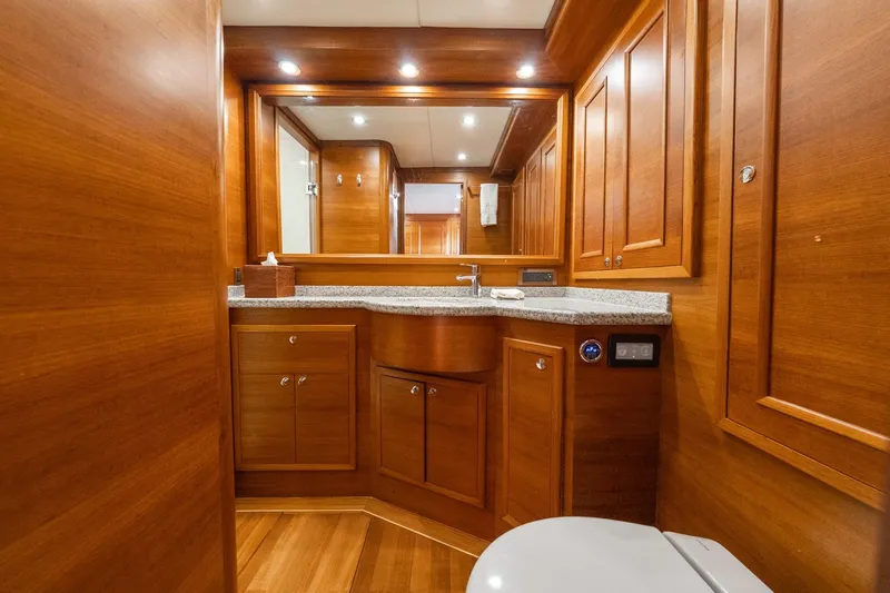 Dash Yacht Photos Pics Luxurious wooden bathroom interior on 2016 Grand Banks 72 Aleutian RP yacht.