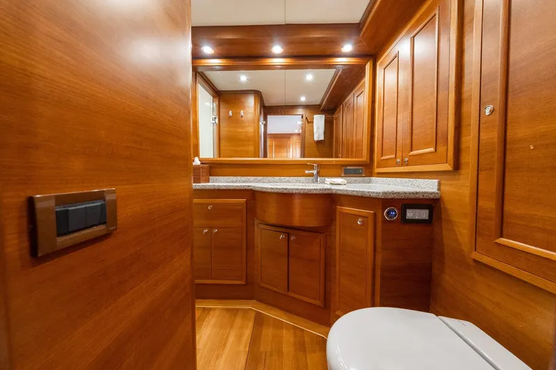 Dash Yacht Photos Pics Luxurious wooden bathroom interior of 2016 Grand Banks 72 Aleutian RP yacht.