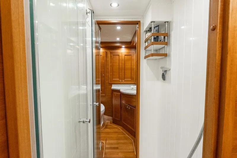 Dash Yacht Photos Pics Luxurious bathroom interior of 2016 Grand Banks 72 Aleutian RP yacht with wooden cabinetry.