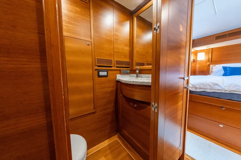 Dash Yacht Photos Pics Luxurious wooden interior of 2016 Grand Banks 72 Aleutian RP yacht cabin.
