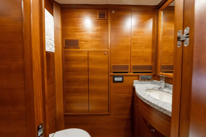 Dash Yacht Photos Pics Luxurious wooden bathroom interior of 2016 Grand Banks 72 Aleutian RP yacht.
