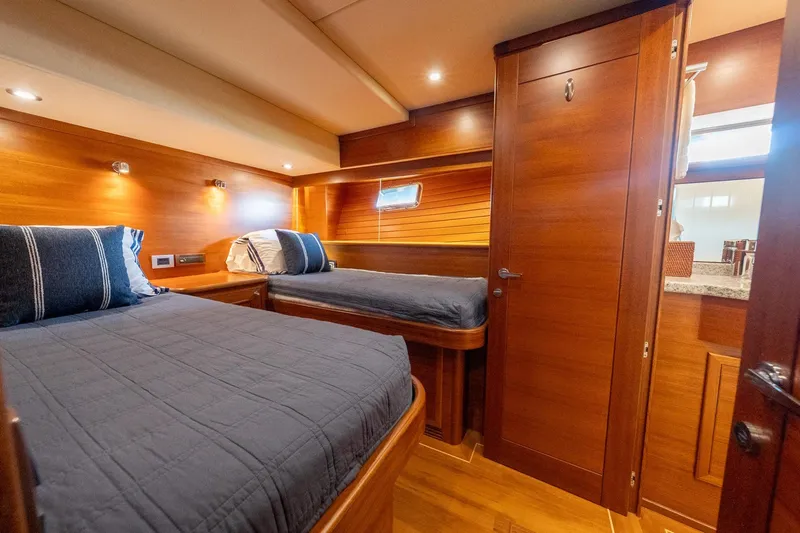 Dash Yacht Photos Pics Luxurious cabin interior of 2016 Grand Banks 72 Aleutian RP yacht with wooden finishes.