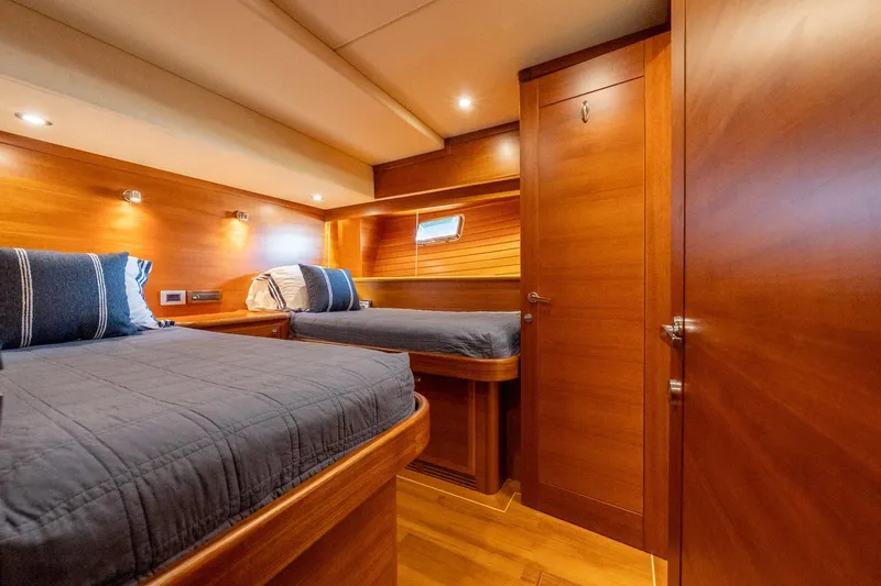 Dash Yacht Photos Pics Luxurious cabin interior of 2016 Grand Banks 72 Aleutian RP yacht with twin beds.