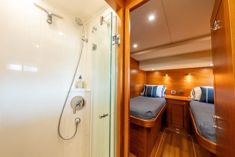 Dash Yacht Photos Pics Luxurious 2016 Grand Banks 72 Aleutian RP yacht interior with twin beds and modern shower.