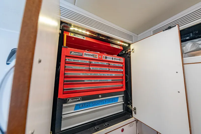 Dash Yacht Photos Pics Toolbox inside a 2016 Grand Banks 72 Aleutian RP yacht storage cabinet.