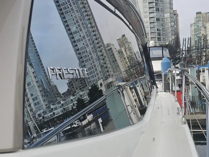 Yes Yacht Photos Pics Prestige 500 S yacht reflecting city skyline in marina, 2016 model.