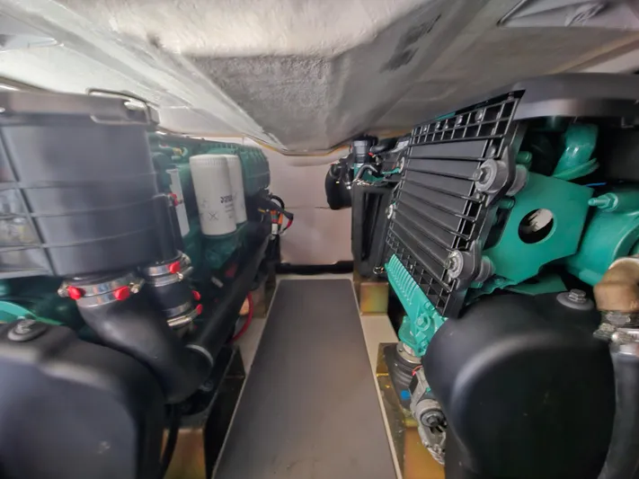 Yes Yacht Photos Pics Engine room of a 2016 Prestige 500 S yacht, showcasing dual engines and mechanical components.