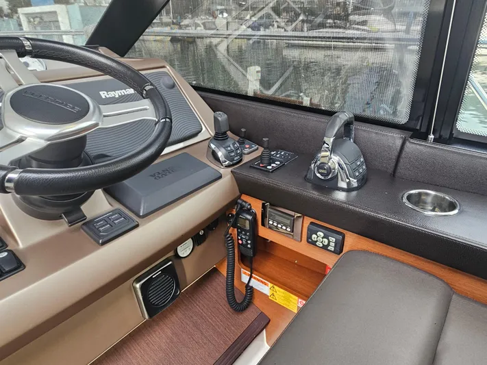Yes Yacht Photos Pics Cockpit of 2016 Prestige 500 S yacht with steering wheel and control panel.