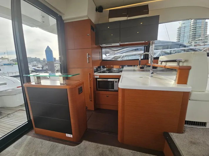 Yes Yacht Photos Pics Luxurious interior of a 2016 Prestige 500 S yacht with modern kitchen amenities.