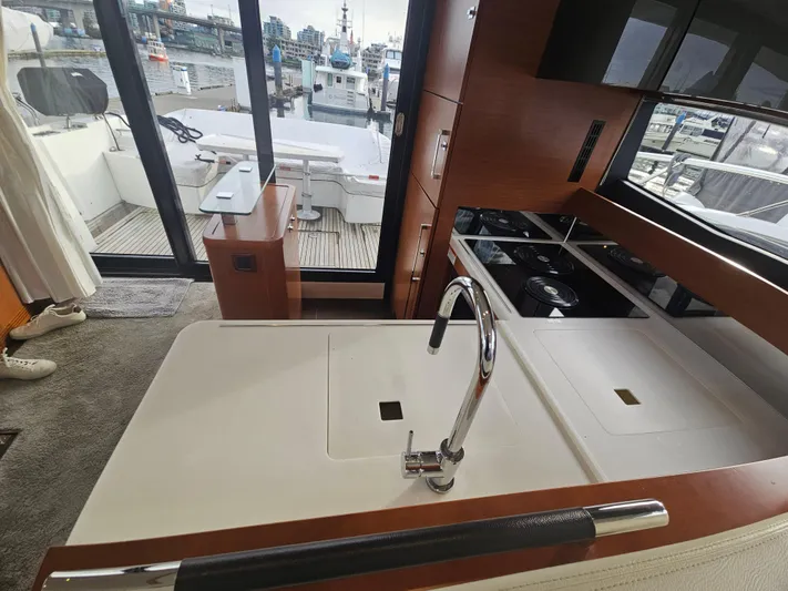 Yes Yacht Photos Pics Modern kitchen interior of 2016 Prestige 500 S yacht with marina view.