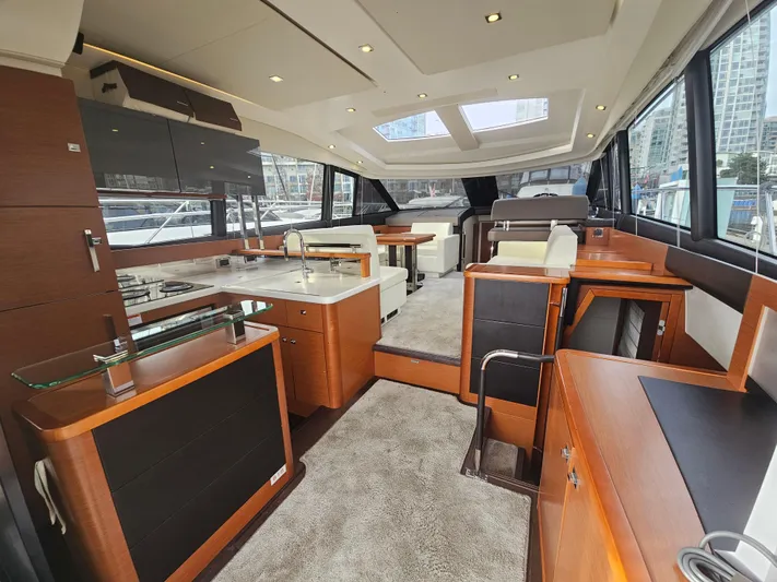 Yes Yacht Photos Pics Luxurious interior of a 2016 Prestige 500 S yacht with modern furnishings and ample natural light.
