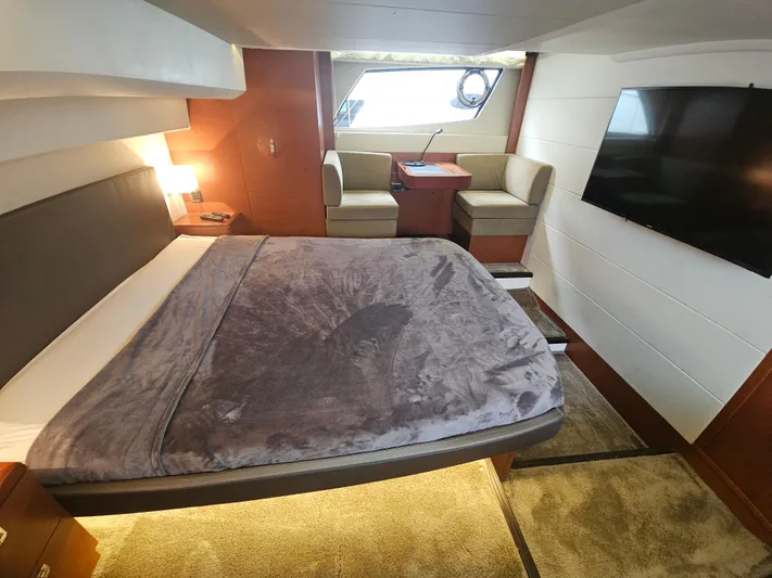 Yes Yacht Photos Pics Luxurious cabin interior of 2016 Prestige 500 S yacht with bed, seating, and TV.