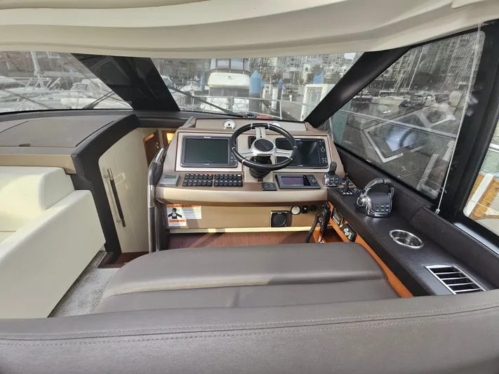 Yes Yacht Photos Pics 2016 Prestige 500 S yacht helm with modern controls and navigation systems.
