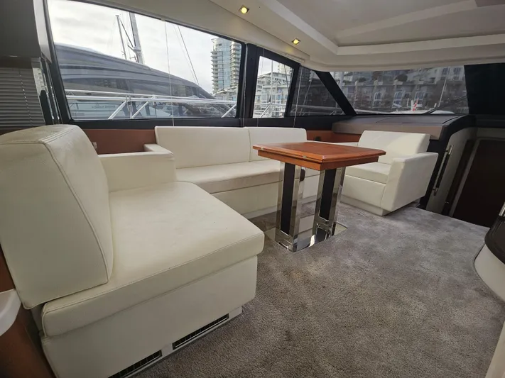 Yes Yacht Photos Pics Luxurious interior of a 2016 Prestige 500 S yacht with elegant seating and table.