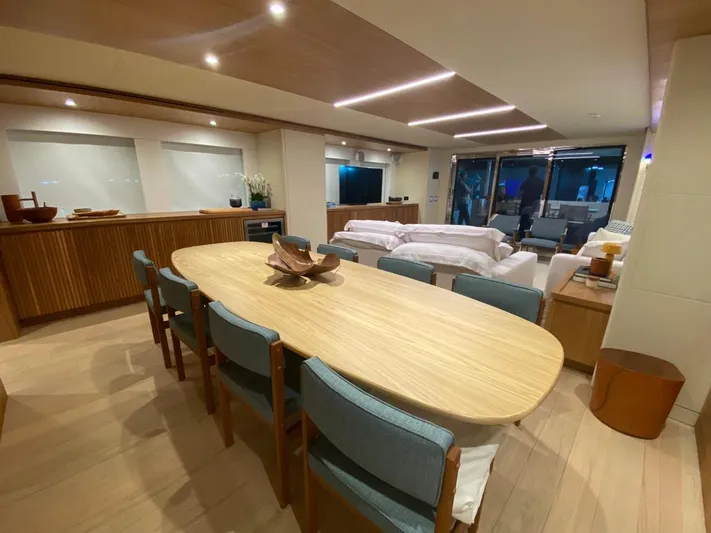  Yacht Photos Pics Luxurious interior of 2027 Inace Explora 90 yacht with modern dining and living area.