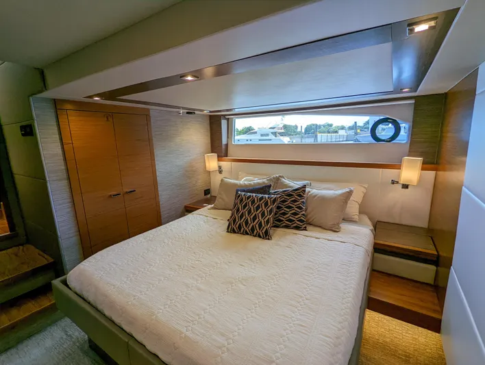 Sapphire Yacht Photos Pics Luxurious bedroom in 2020 Tiara Yachts F53 Flybridge with modern decor and ample natural light.