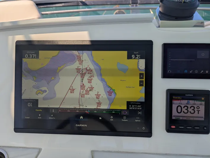 Sapphire Yacht Photos Pics Garmin navigation display on 2020 Tiara Yachts F53 Flybridge, showing nautical chart and compass.