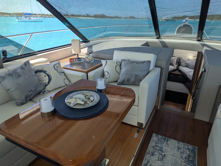 Sapphire Yacht Photos Pics Luxurious interior of 2020 Tiara Yachts F53 Flybridge with elegant seating and ocean view.