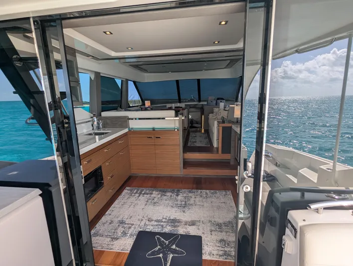 Sapphire Yacht Photos Pics Interior of 2020 Tiara Yachts F53 Flybridge with ocean view through glass doors.