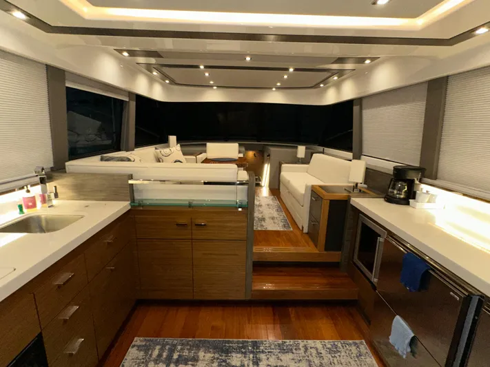 Sapphire Yacht Photos Pics Luxurious interior of 2020 Tiara Yachts F53 Flybridge with modern kitchen and seating area.