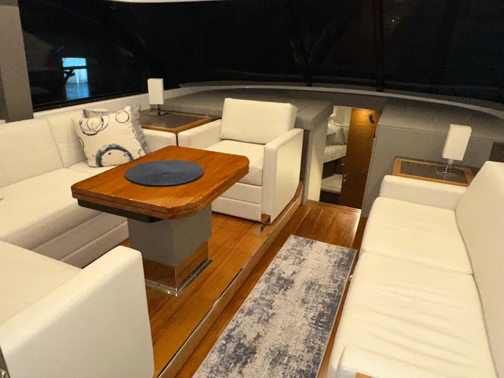 Sapphire Yacht Photos Pics Luxurious interior of 2020 Tiara Yachts F53 Flybridge with elegant seating and wooden table.