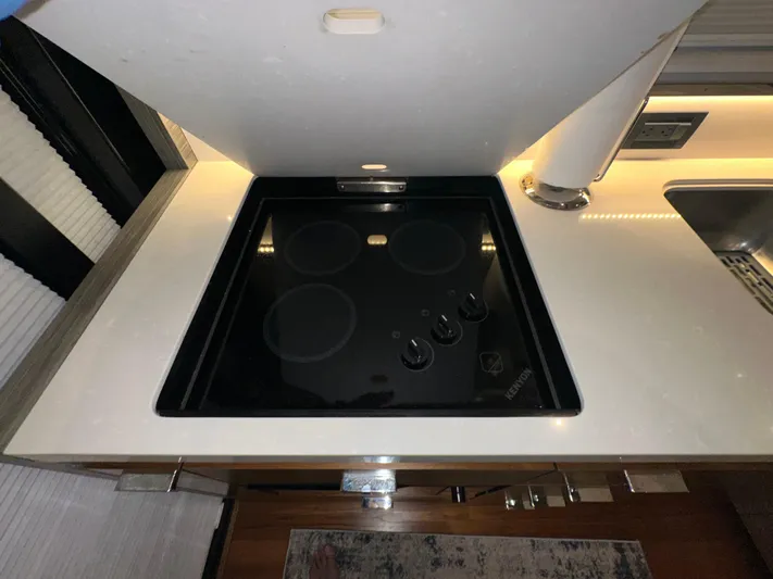 Sapphire Yacht Photos Pics Modern kitchen stove in 2020 Tiara Yachts F53 Flybridge, featuring sleek design and controls.