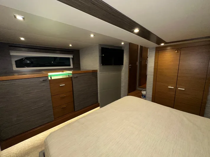 Sapphire Yacht Photos Pics Luxurious interior of 2020 Tiara Yachts F53 Flybridge with modern wood cabinetry and ambient lighting.