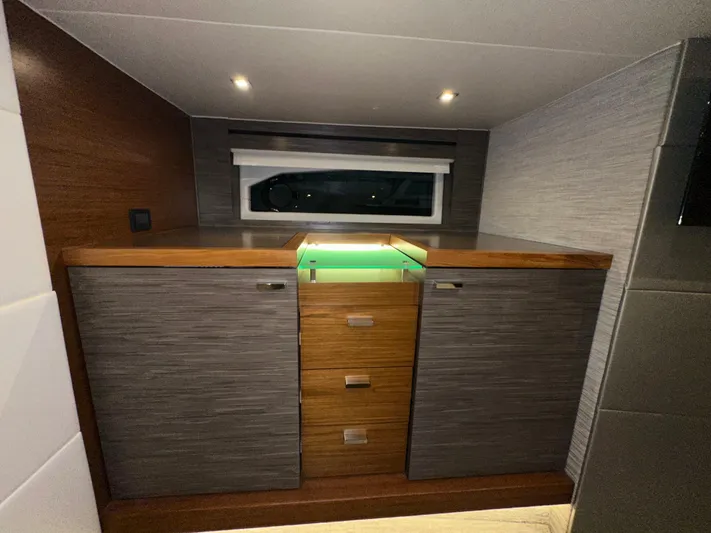 Sapphire Yacht Photos Pics Luxurious interior of 2020 Tiara Yachts F53 Flybridge with modern cabinetry and ambient lighting.