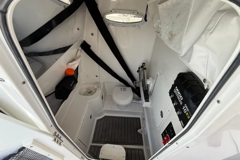 Afterthought Yacht Photos Pics Interior of 2022 Sea Hunt Gamefish 30 Coffin Box boat, featuring compact bathroom amenities.