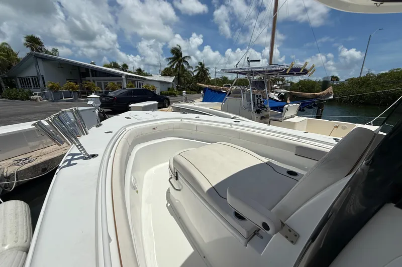 Afterthought Yacht Photos Pics 2022 Sea Hunt Gamefish 30 Coffin Box boat docked under a sunny sky.